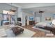Spacious bedroom with wood floors, ceiling fans, and a view to the backyard at 1532 Via Cassia, Henderson, NV 89052