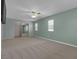 A spacious bedroom with dual windows, a sliding closet, and plush carpeting for a cozy feel at 1532 Via Cassia, Henderson, NV 89052