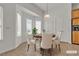 Charming dining area with natural light, a round table set for four, and built-in storage cabinets at 1532 Via Cassia, Henderson, NV 89052
