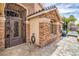 Elegant home entrance with stone accents and decorative iron gate at 1532 Via Cassia, Henderson, NV 89052