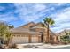 Charming single-story home featuring a three-car garage, desert landscaping, and a beautiful stone facade at 1532 Via Cassia, Henderson, NV 89052