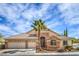 Charming single-story home featuring a three-car garage, desert landscaping, and a beautiful stone facade at 1532 Via Cassia, Henderson, NV 89052