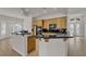 Spacious kitchen with black granite countertops and natural wood cabinetry at 1532 Via Cassia, Henderson, NV 89052