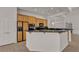 Modern kitchen with black granite countertops and stainless steel appliances, perfect for cooking and entertaining at 1532 Via Cassia, Henderson, NV 89052