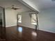 Bright and airy living room with wood floors and neutral tones throughout at 1532 Via Cassia, Henderson, NV 89052