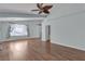 Hardwood floors accent a living room with neutral paint and generous natural light at 1532 Via Cassia, Henderson, NV 89052