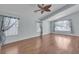 Spacious living room featuring hardwood floors, a fan, and great natural light at 1532 Via Cassia, Henderson, NV 89052