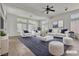 Bright living room with modern furnishings and large windows at 1532 Via Cassia, Henderson, NV 89052