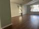 Open concept living room featuring hardwood floors and natural light from the windows at 1532 Via Cassia, Henderson, NV 89052