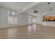 Large open living room with abundant natural light and kitchen area at 1532 Via Cassia, Henderson, NV 89052