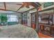 Bright and spacious main bedroom featuring a four-poster bed, wood floors, and a built in entertainment center at 1532 Via Cassia, Henderson, NV 89052