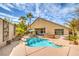 Backyard oasis featuring a sparkling pool, hot tub, and outdoor dining area, perfect for entertaining at 1532 Via Cassia, Henderson, NV 89052