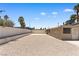 Large backyard area featuring desert landscaping, a concrete patio, and a secure, enclosed space at 1655 E Hacienda Ave, Las Vegas, NV 89119