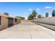 Expansive backyard showcasing a concrete patio and low-maintenance desert landscaping, perfect for outdoor enjoyment at 1655 E Hacienda Ave, Las Vegas, NV 89119