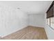 Bedroom features wood floors, neutral walls, and window at 1655 E Hacienda Ave, Las Vegas, NV 89119