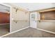 Bedroom with carpet, closet, and a door leading to the outside at 1655 E Hacienda Ave, Las Vegas, NV 89119
