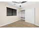 Bedroom with carpet, closet, and a window with blinds at 1655 E Hacienda Ave, Las Vegas, NV 89119