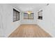 Bright dining room with wood floors, modern lighting and large windows at 1655 E Hacienda Ave, Las Vegas, NV 89119