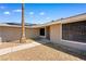 Home exterior with solar panels, desert landscaping and secure windows at 1655 E Hacienda Ave, Las Vegas, NV 89119