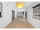 Bright hallway with wood floors and neutral walls at 1655 E Hacienda Ave, Las Vegas, NV 89119