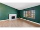 A spacious living room featuring hardwood floors, natural light, and a modern fireplace at 1655 E Hacienda Ave, Las Vegas, NV 89119
