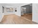 Spacious living room with wood floors and modern light fixture at 1655 E Hacienda Ave, Las Vegas, NV 89119