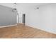 Living room showcases stylish lighting and features light wood-look floors throughout at 1655 E Hacienda Ave, Las Vegas, NV 89119