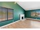 A spacious living room featuring hardwood floors, natural light, and a modern fireplace at 1655 E Hacienda Ave, Las Vegas, NV 89119
