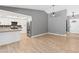 Bright living room featuring an open floor plan and a kitchen with stainless steel appliances at 1655 E Hacienda Ave, Las Vegas, NV 89119