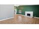 A spacious living room featuring hardwood floors, natural light, and a modern fireplace at 1655 E Hacienda Ave, Las Vegas, NV 89119