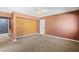 Comfortable main bedroom featuring neutral carpeting and an accent wall at 1655 E Hacienda Ave, Las Vegas, NV 89119