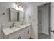 Modern bathroom featuring a double vanity with white countertops and brushed gold fixtures at 1731 Sherwin Ln, Las Vegas, NV 89156