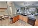 Open kitchen design with breakfast bar, seamlessly flowing into the living area for modern living at 2598 Fountain Ave, Pahrump, NV 89048
