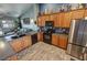 Bright kitchen with stainless steel appliances, wood cabinetry, and a functional layout for cooking and entertaining at 2598 Fountain Ave, Pahrump, NV 89048
