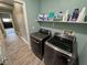 Convenient laundry room with modern washer and dryer, plus ample storage space at 2598 Fountain Ave, Pahrump, NV 89048