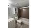 Clean bathroom featuring a bathtub, shower, toilet, vanity, and cabinet at 2606 S Durango Dr # 122, Las Vegas, NV 89117