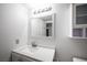 Bathroom vanity features a sink, mirror, and storage, bright and clean at 2606 S Durango Dr # 122, Las Vegas, NV 89117
