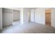 Bright bedroom featuring new gray flooring and mirrored closet at 2606 S Durango Dr # 122, Las Vegas, NV 89117