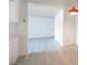 Open floor plan features updated flooring, white walls and kitchen area at 2606 S Durango Dr # 122, Las Vegas, NV 89117