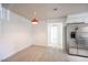 Eat-in kitchen area with stainless steel refrigerator and updated lighting at 2606 S Durango Dr # 122, Las Vegas, NV 89117