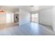 Open-concept living area featuring modern floors and a sliding glass door to a balcony at 2606 S Durango Dr # 122, Las Vegas, NV 89117