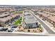 Wide aerial shot showing a community with modern townhomes and lush green spaces at 267 Cordelia Cove Ave # 812, Henderson, NV 89011