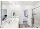 Bright bathroom showcasing a double sink vanity, and a glass-enclosed shower at 267 Cordelia Cove Ave # 812, Henderson, NV 89011
