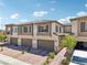 Beautiful two-story townhome boasts a two-car garage and inviting curb appeal at 267 Cordelia Cove Ave # 812, Henderson, NV 89011