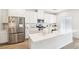 Modern kitchen featuring white cabinets, quartz countertops, and stainless steel appliances at 267 Cordelia Cove Ave # 812, Henderson, NV 89011