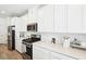 Beautiful, well-lit kitchen featuring modern stainless steel appliances and quartz countertops at 267 Cordelia Cove Ave # 812, Henderson, NV 89011