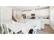Bright kitchen and dining area featuring stainless steel appliances and modern white cabinetry at 267 Cordelia Cove Ave # 812, Henderson, NV 89011