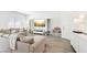 Open-concept living room with wood-look flooring, ample natural light, and stylish decor at 267 Cordelia Cove Ave # 812, Henderson, NV 89011