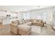Open-concept living room with a view of the modern kitchen and dining area, bright and inviting at 267 Cordelia Cove Ave # 812, Henderson, NV 89011
