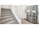 Carpeted staircase leading to the upper level of the home near a stainless steel refrigerator at 267 Cordelia Cove Ave # 812, Henderson, NV 89011